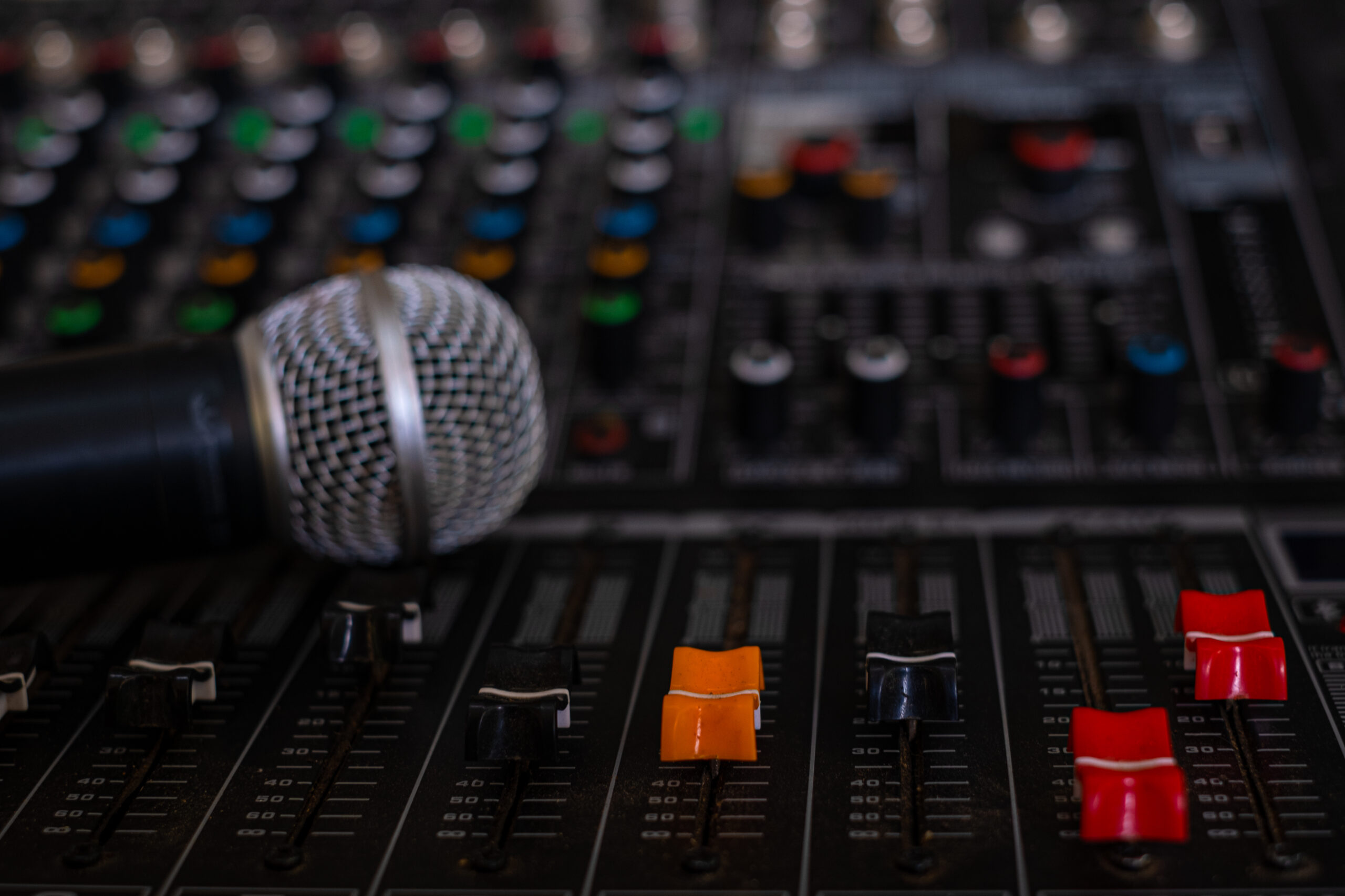 Microphone and audio sound mixer analog at the sound control room on blurred background
